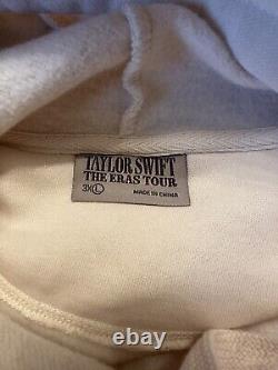 Merchandising officiel du Taylor Swift Eras Tour : Sweat à capuche couleur crème beige, taille 3XL.